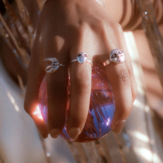 Sterling silver retro rings holding a crystal ball